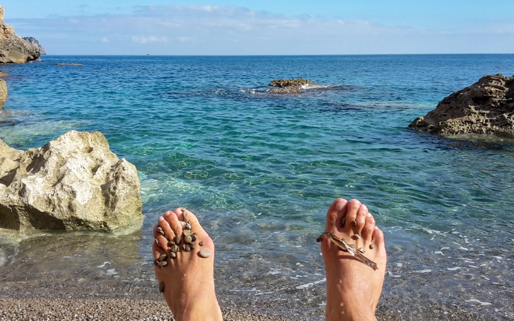 På stranden vid Coll Baix
